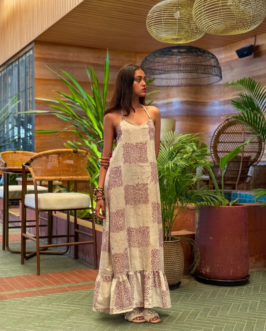 Grid and Gather cotton halter maxi dress, side view showing the drape and frill hem